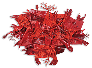 A tangle of red fabric-like shapes with symbols on them.