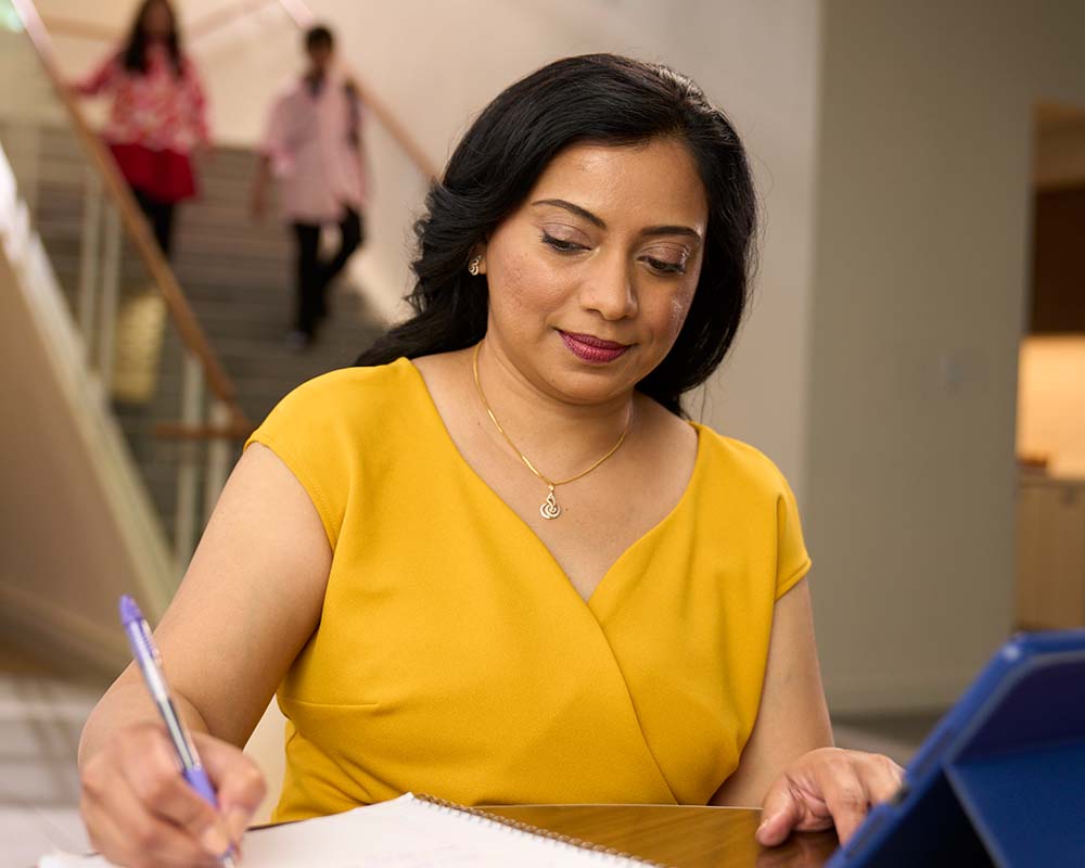 A person taking notes.