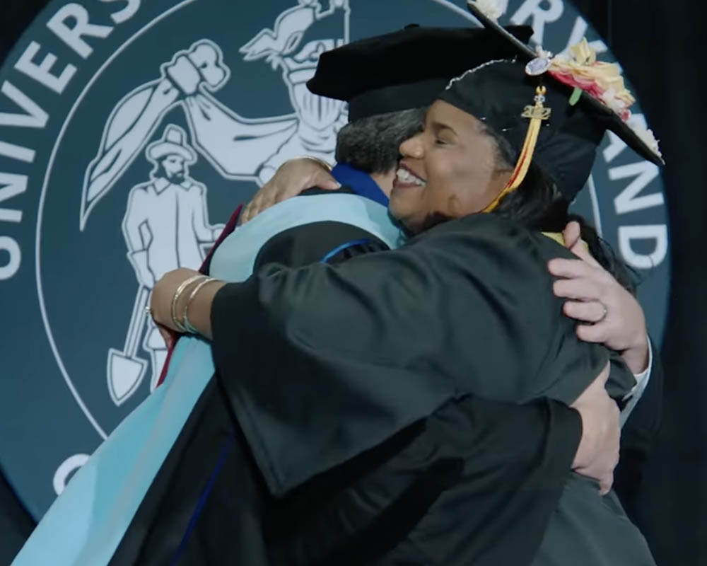 Video thumbnail image of a UMGC student graduating
