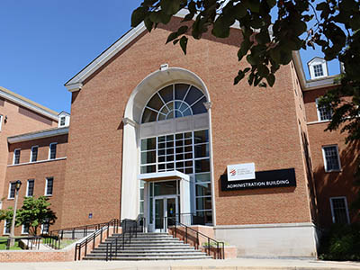 UMGC’s headquarters, a brick building.