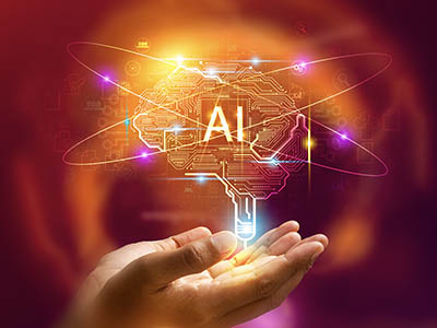 An abstract image of lights and circuits rising up from a person's hands with the letters A and I overlayed.