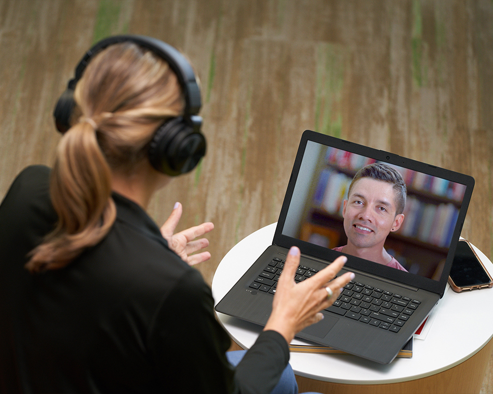 Two people on a video conference call.