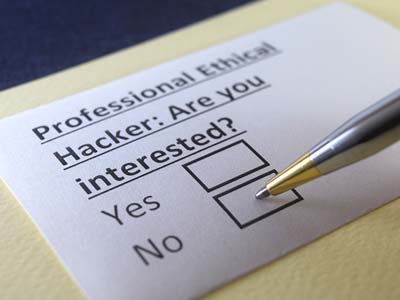A piece of paper with the words, "Professional Ethical Hacker: Are you interested?" followed by Yes and No checkboxes.