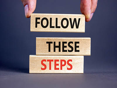 Three wooden blocks with the words, "Follow, These, and Steps" on each block.
