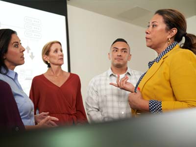 Four people having a discussion.