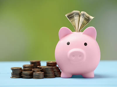 A piggy bank and money.