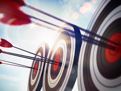 Three targets with arrows in their centers.