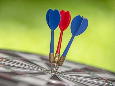 Three darts in a bullseye.