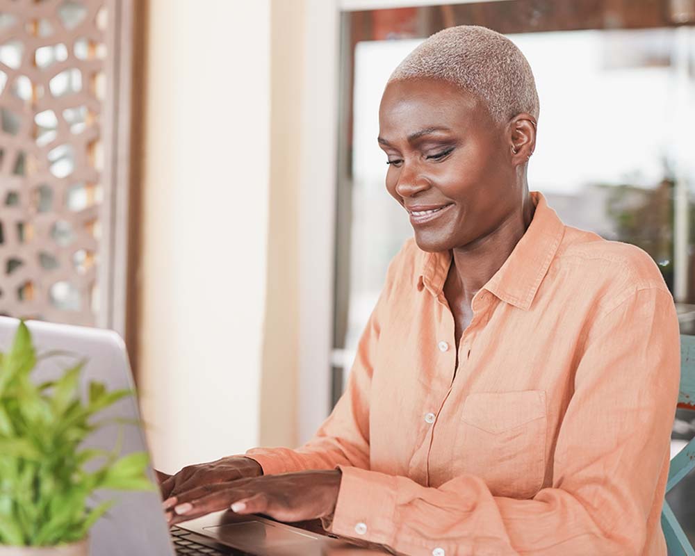 A person typing on a laptop.