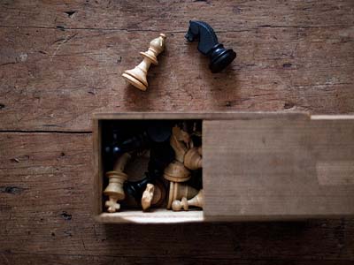 Chess pieces on a wooden table.