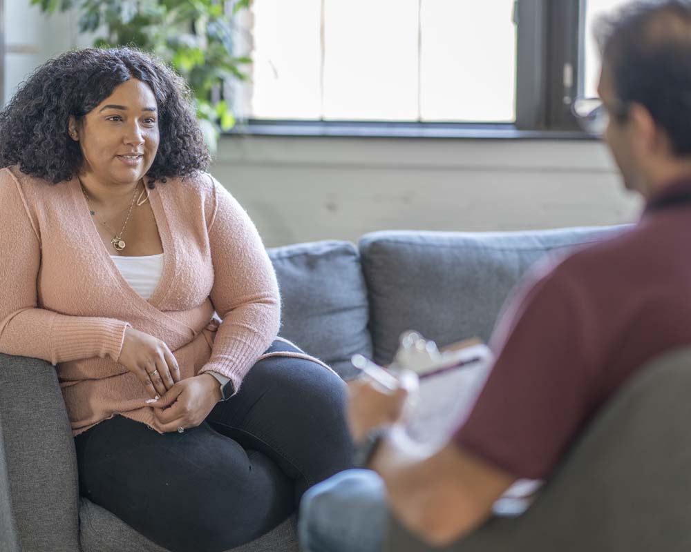 Two people sitting and talking.