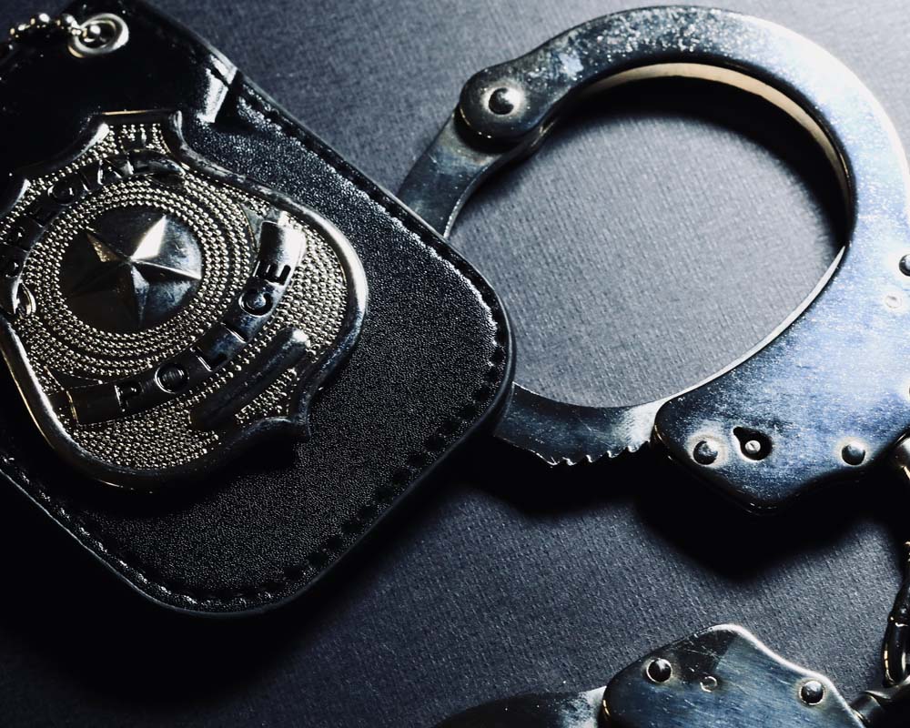A police badge and handcuffs.