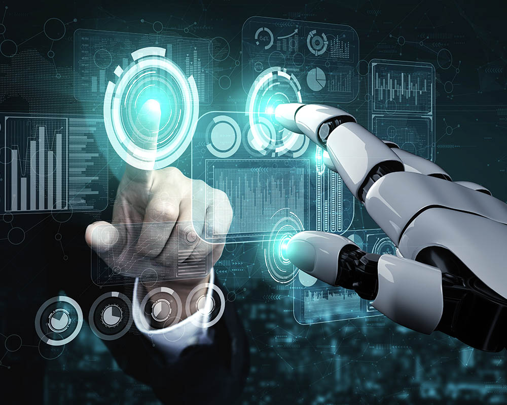 A human hand and a robot hand both pointing to a digital screen.