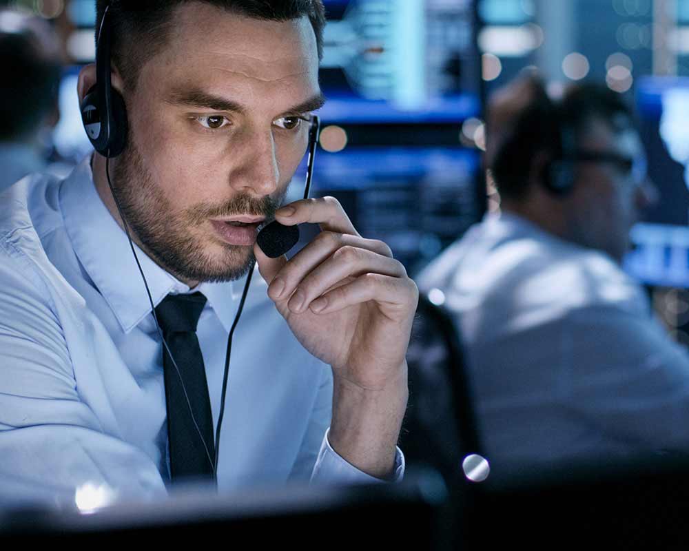 A person talking into a headset.