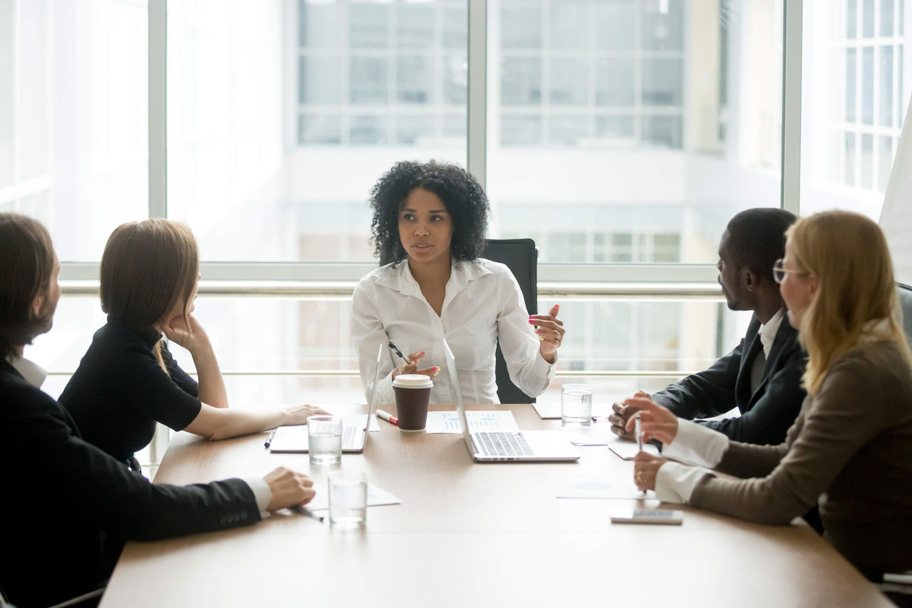 A woman leading a business meeting.