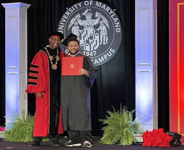 UMGC's President Fowler with a graduate at commencement.