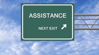 A sign that says 'assistance, next exit'.