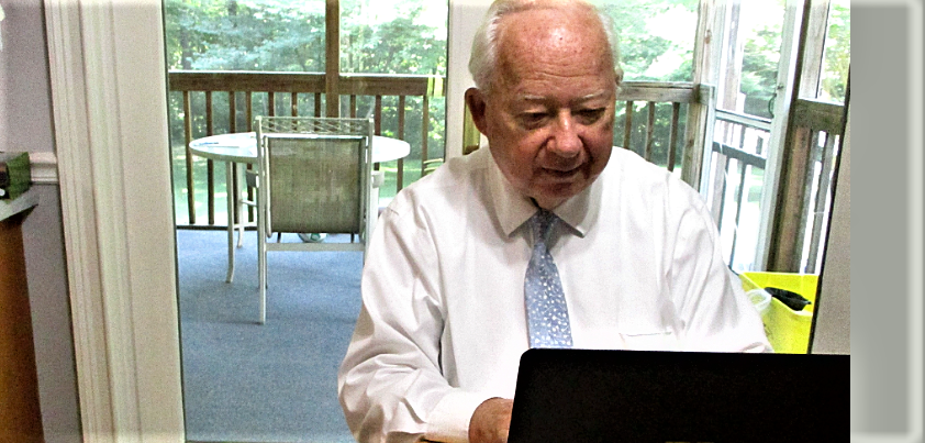 UMGC Faculty at their dinner table working online.