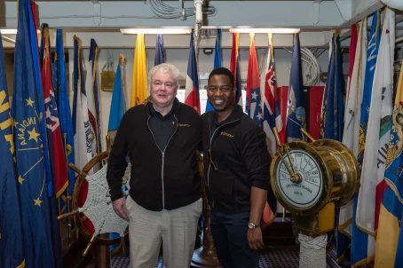 Jim Cronin and UMGC President Greg Fowler on the USS Ronald Reagan