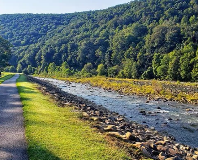 A river flows through a wooded area in Garrett County, Maryland.
