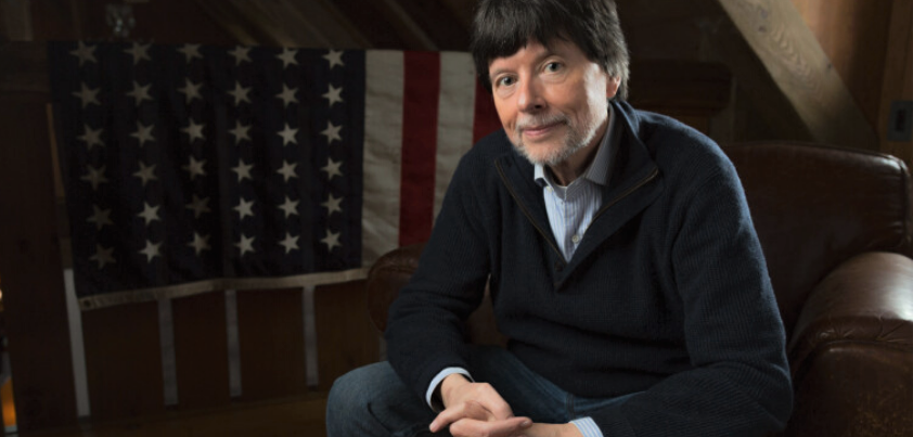 Filmmaker Ken Burns in front of an American Flag