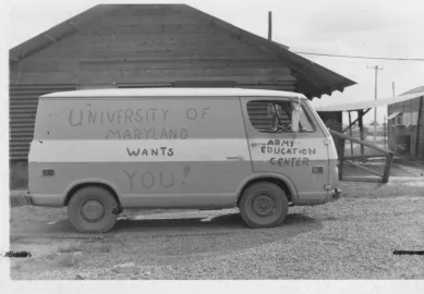 Van with University of Maryland Wants You on an army base