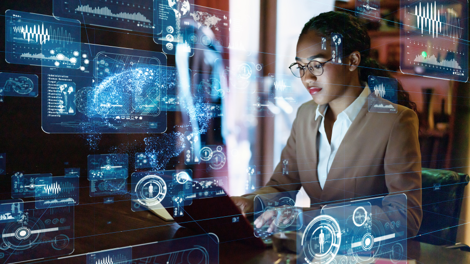 A woman in front of a computer workstation