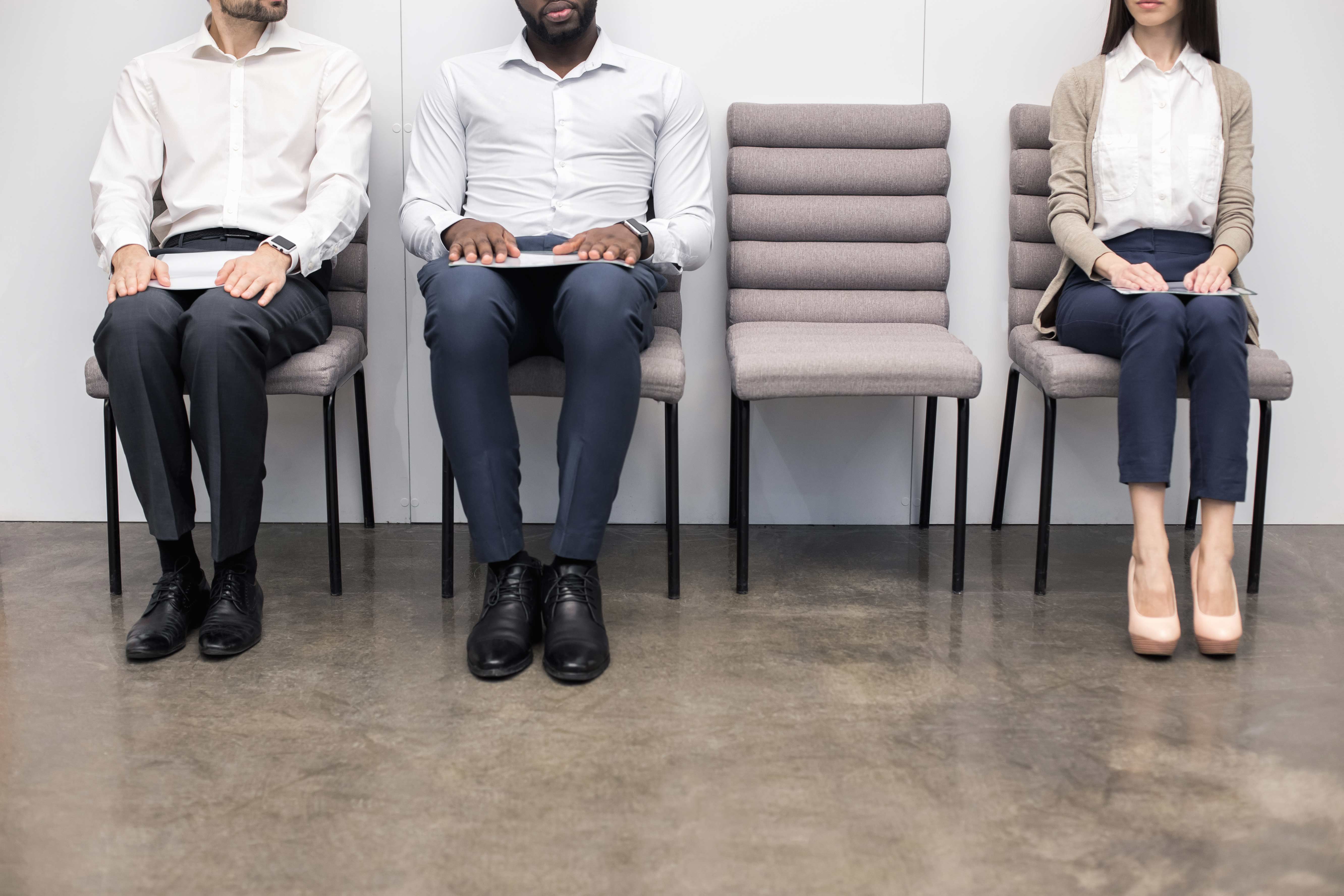 Job candidates waiting in an office.