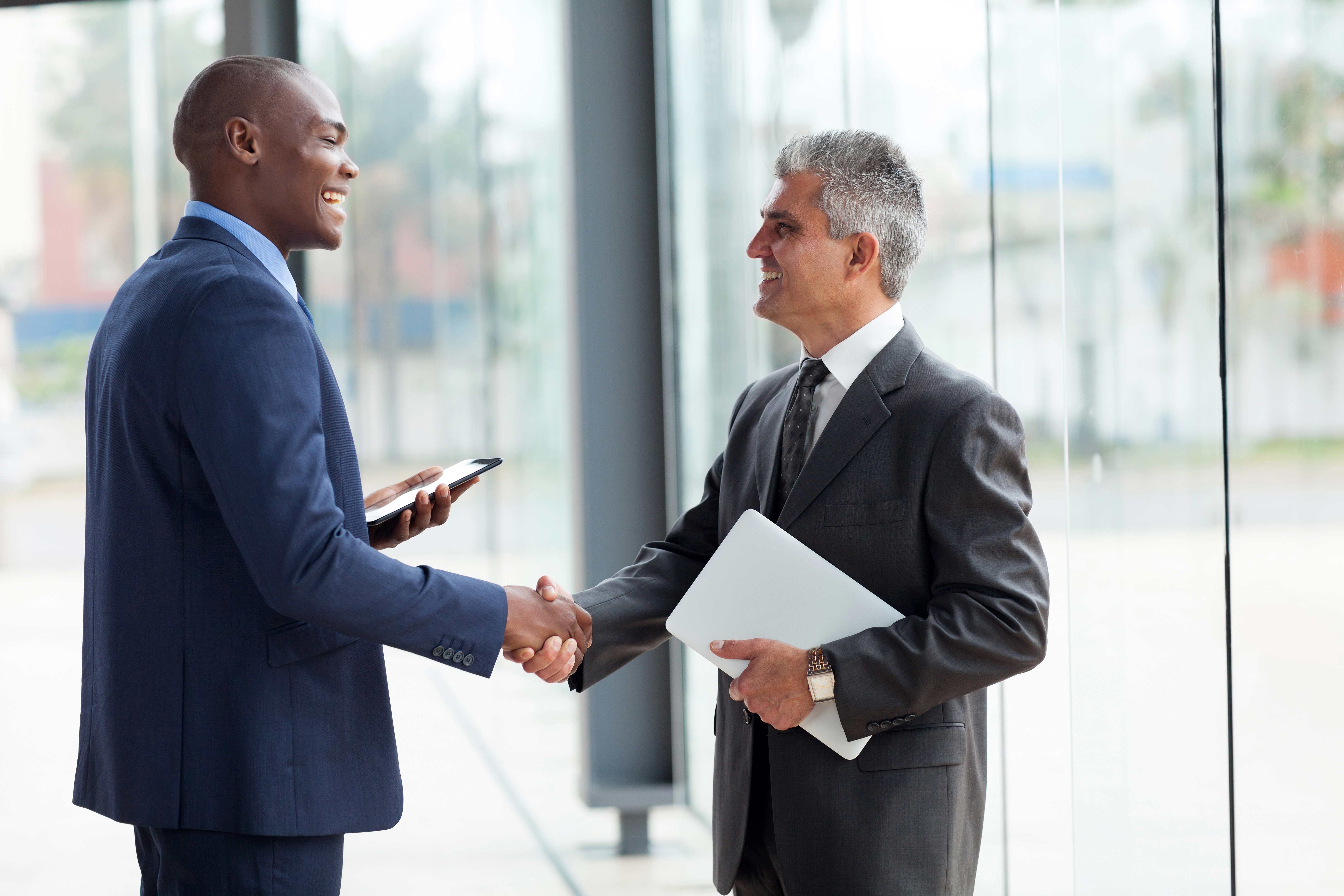 Two businessmen shaking hands.