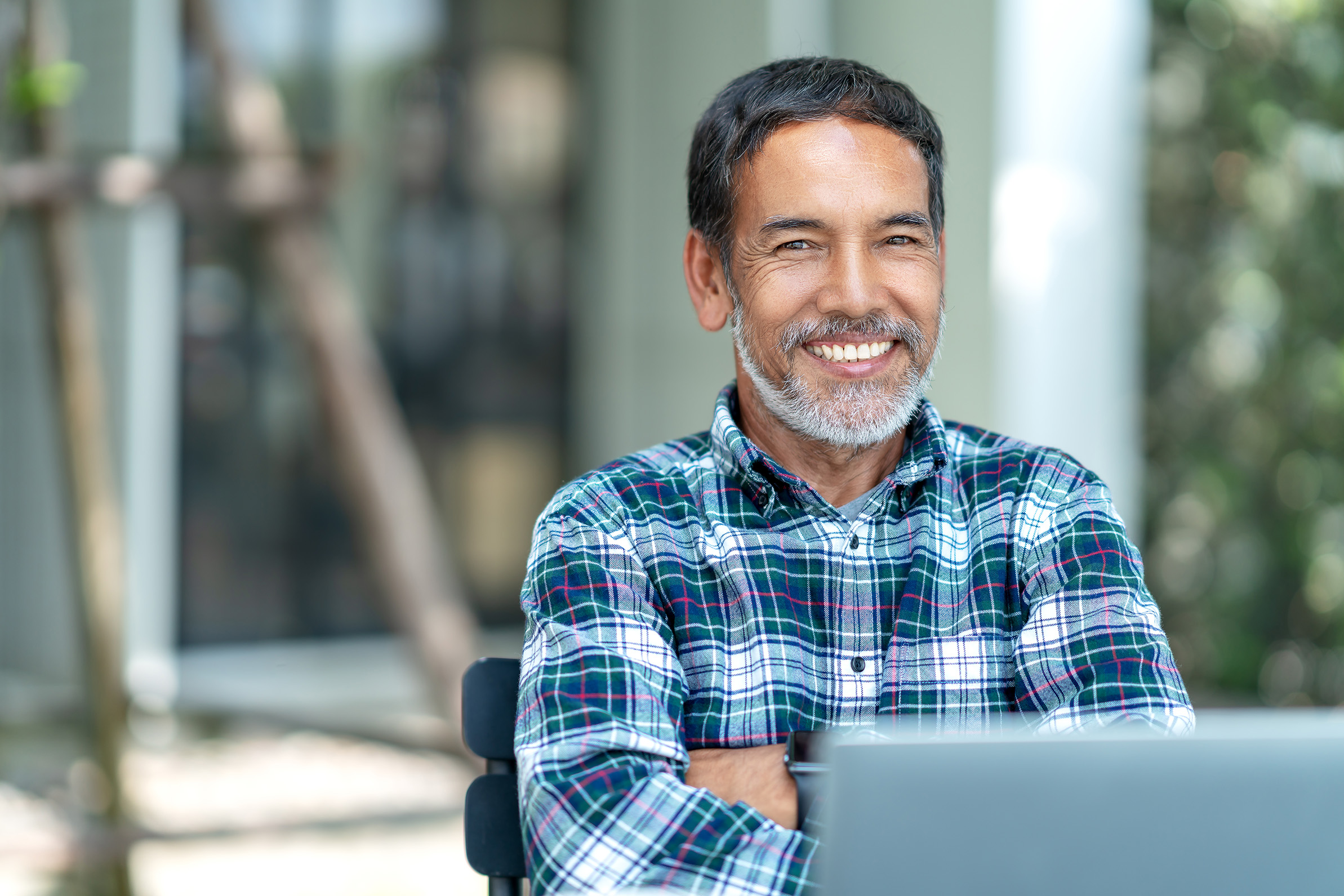 A man outside smiling.