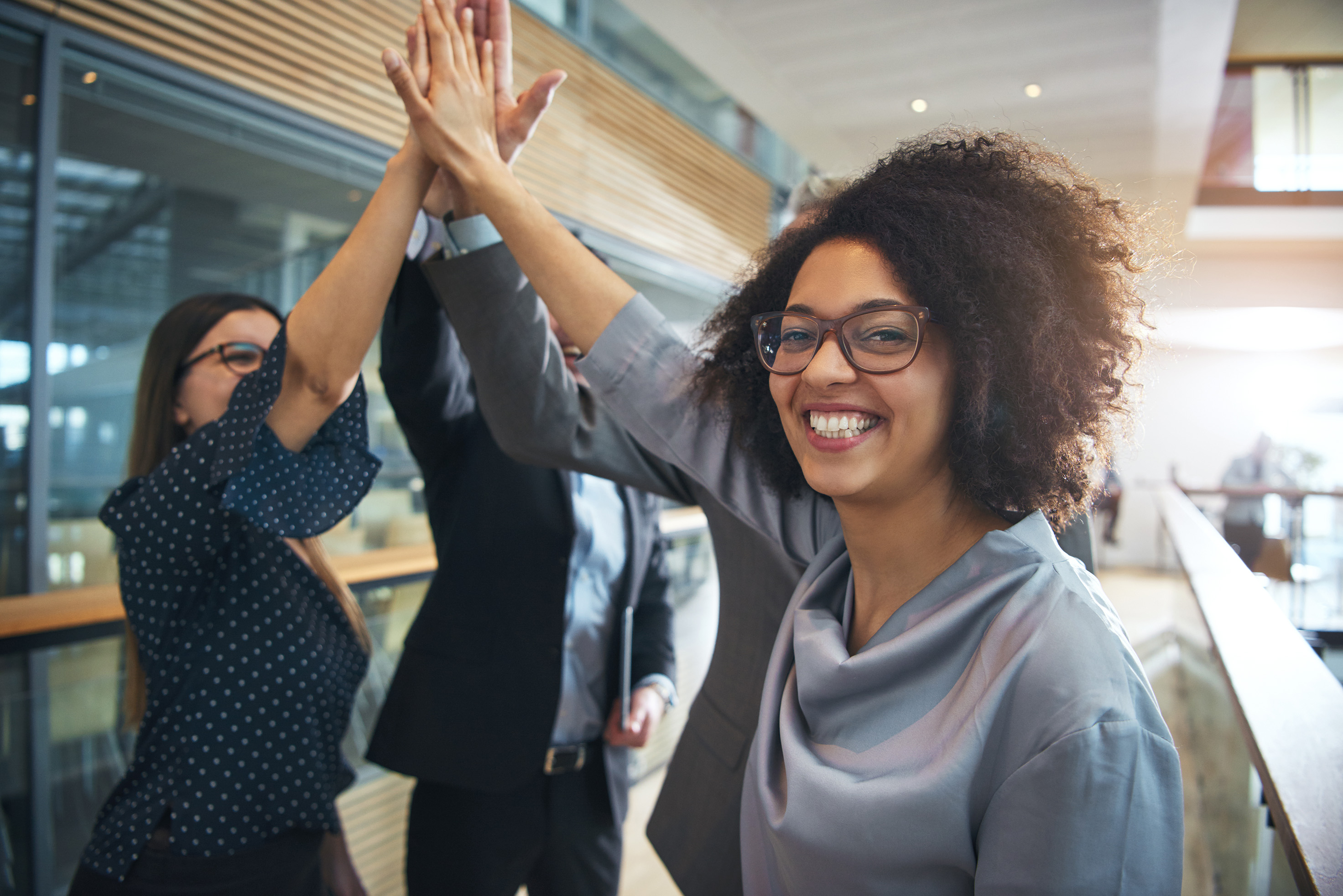 A group of people high-fiving.