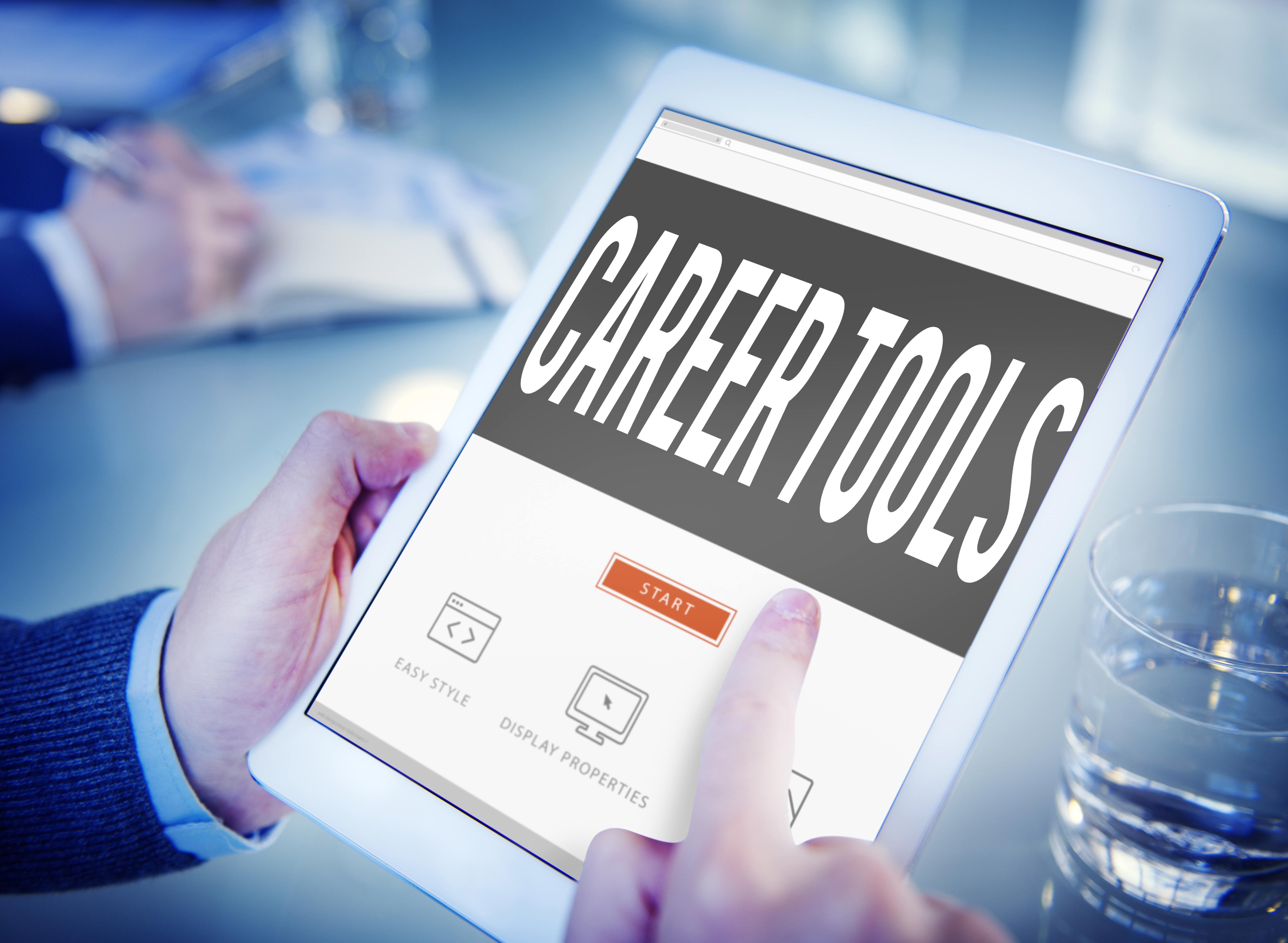 A man holding a tablet which displays the title 'Career Tools'