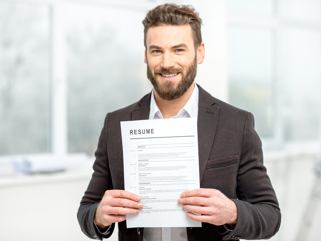 Professional holds up resume 