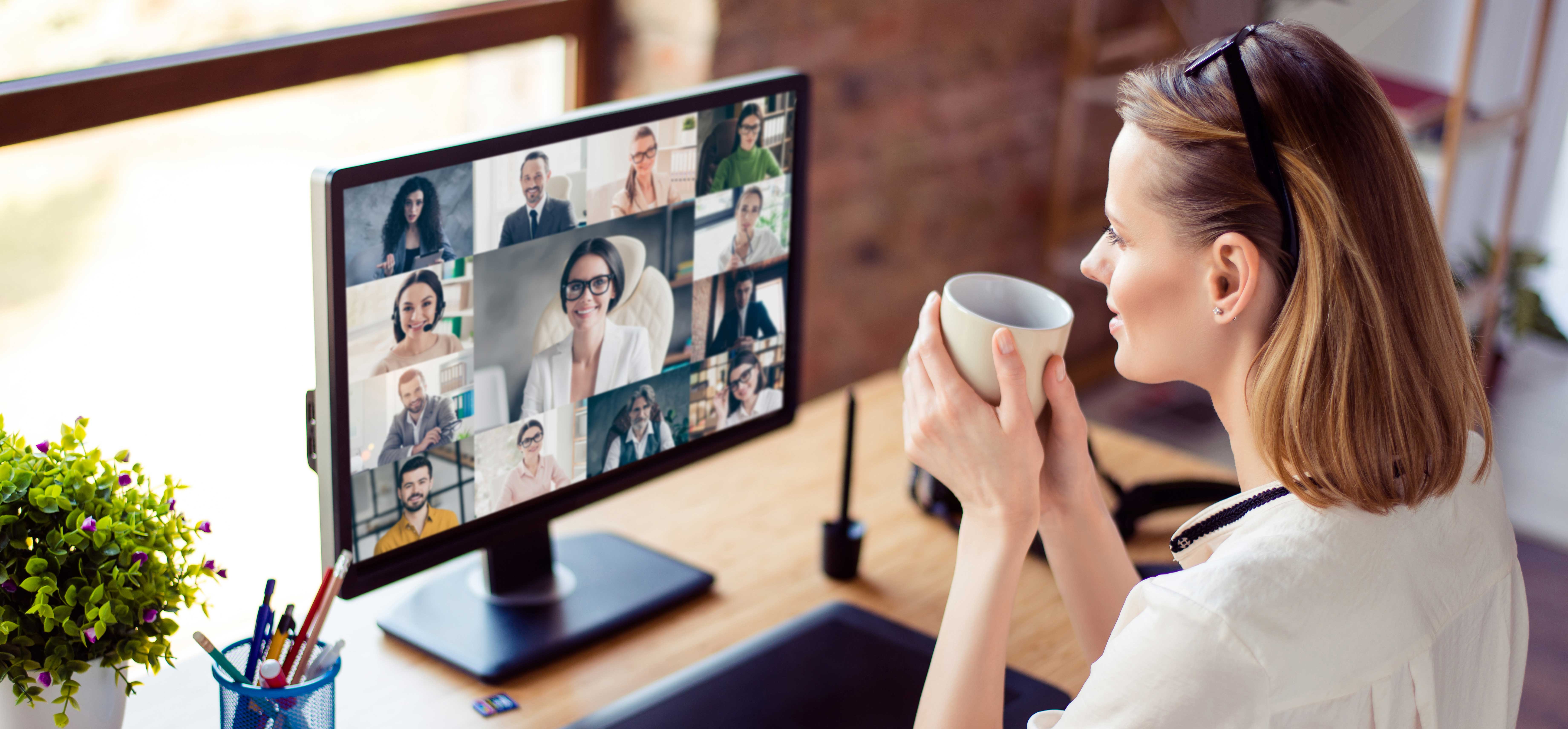 A professional talking on zoom to others.