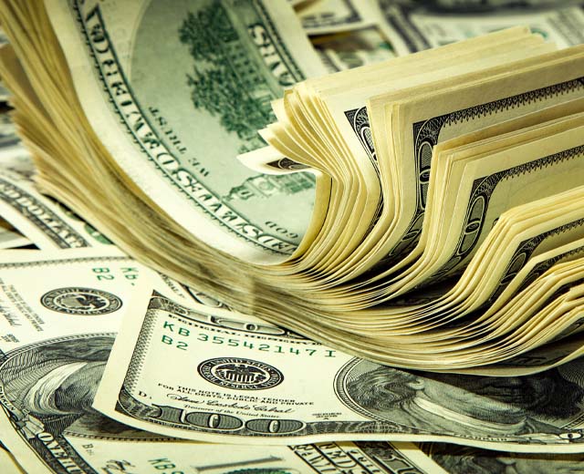 A pile of hundred dollar bills.