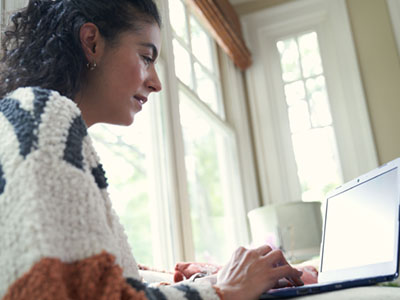 A woman studying at her computer