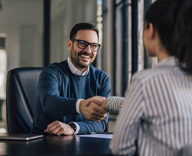 Two people shaking hands.