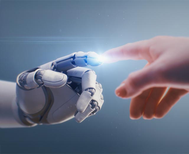 A human's finger touching a robot's finger..