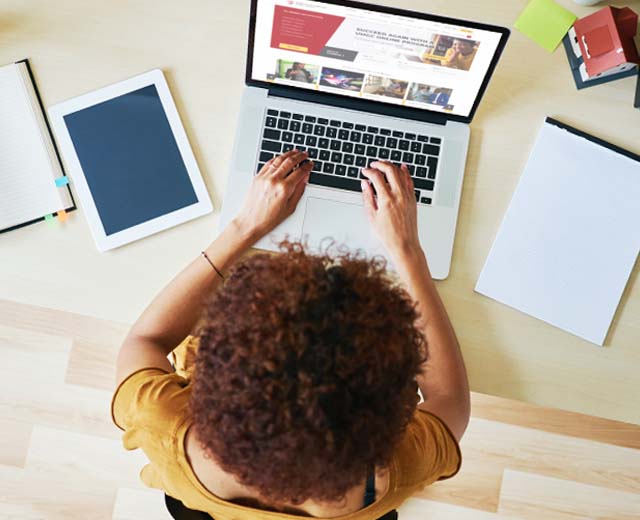 A person typing on a laptop.