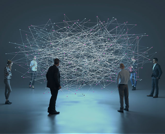 An image of several people looking at data connections.