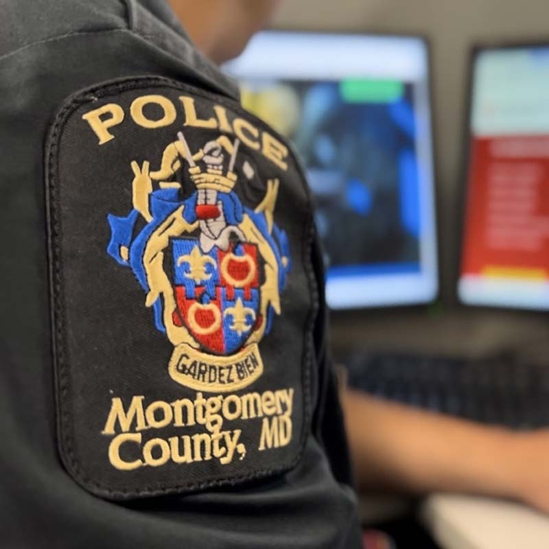 A Montgomery County, Maryland police officer at their desk.