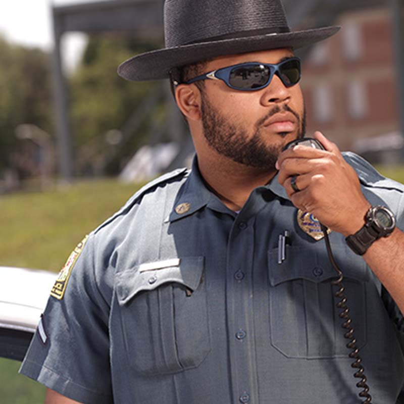 Police officer in uniform on a radio