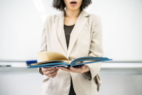 how to write essay draft Woman reading aloud