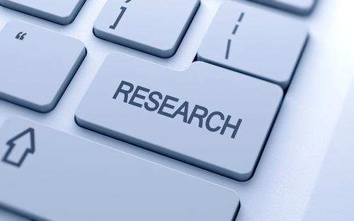 the purpose of a research paper Research word button on keyboard with soft focus