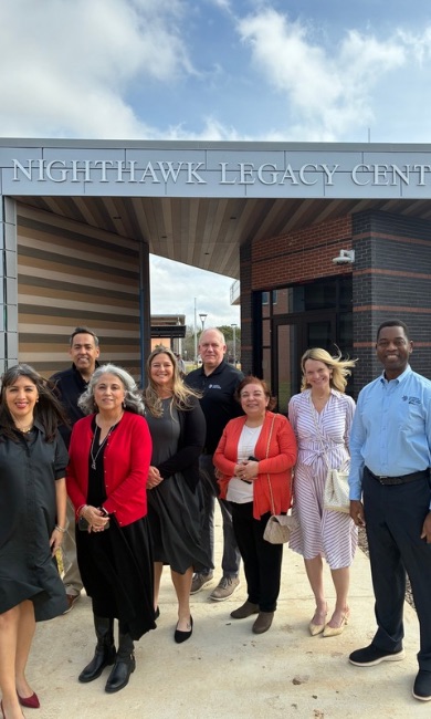 Leaders from UMGC and Alamo Colleges District pose in front of the Nighthawk Legacy Center in Universal City, Texas. 