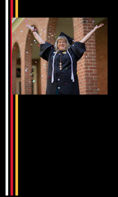 Shelly Kiss throws confetti in the air outside Grad Walk.