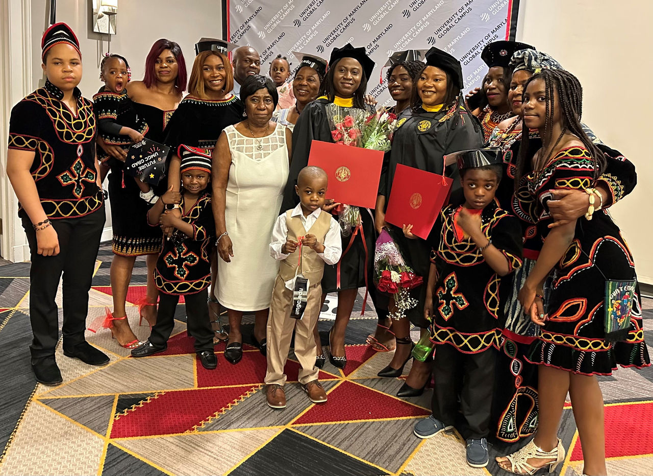Tatiana Nwefor and her sister-in-law Gisele Chawchang celebrate with their family.
