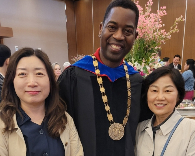 You-Sook Yoon (left), UMGC President Gregory Fowler, and Eun-Mi Seo