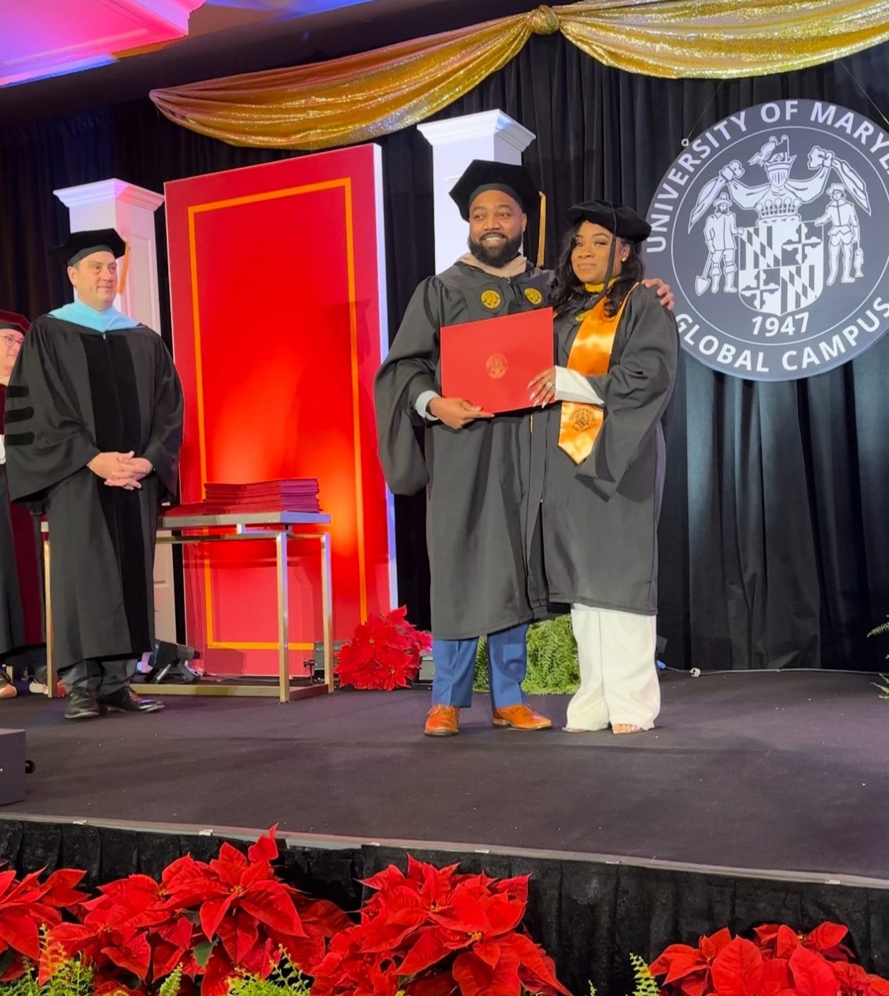 Virginia House of Delegates member Rozia Henson awarded UMGC degree to his sister Ancha' Maples.