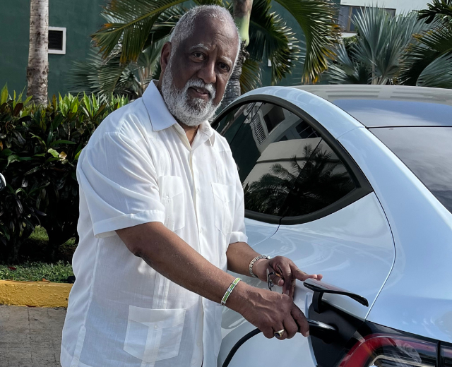 John Felder with the Tesla he exported to Cuba.